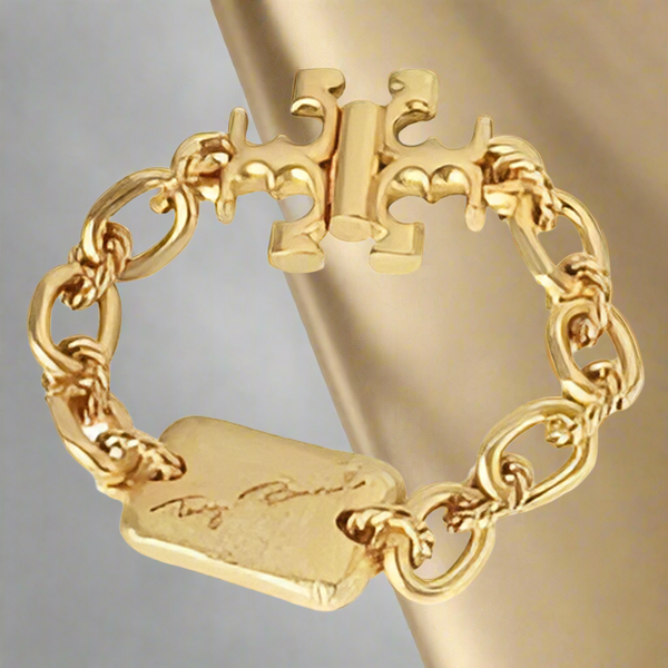 Tory Burch Bracelet Torsade Engraved Logo In Vintage Gold Brass