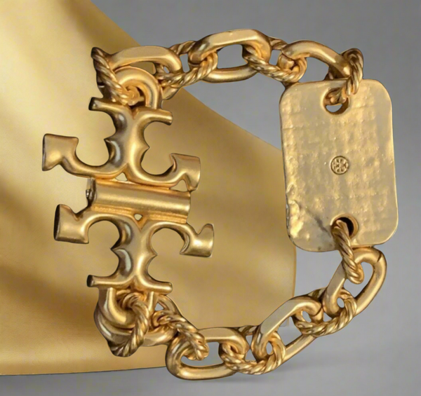 Tory Burch Bracelet Torsade Engraved Logo In Vintage Gold Brass