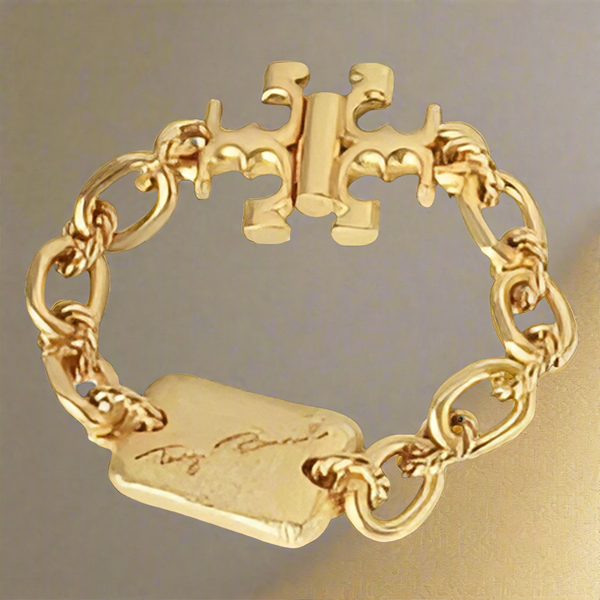 Tory Burch Bracelet Torsade Engraved Logo In Vintage Gold Brass