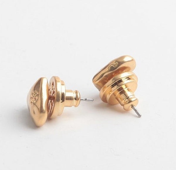 Auténticos aretes de corazón de oro vintage de Tory Burch