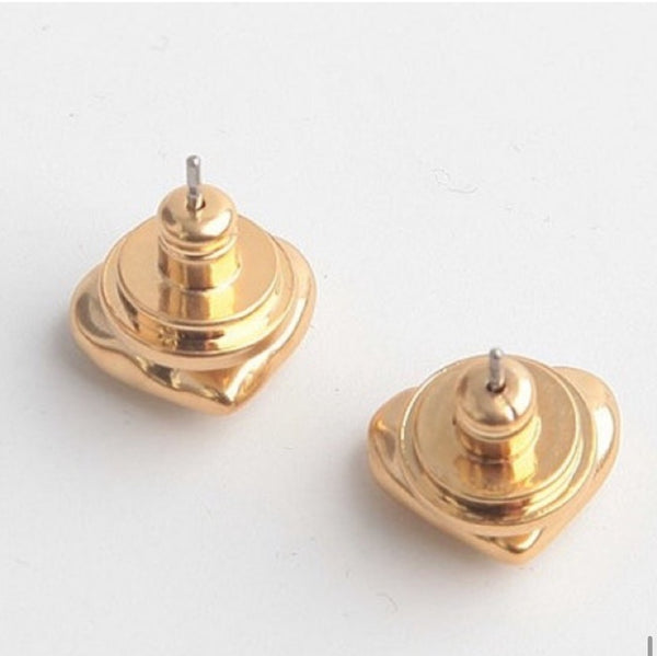Auténticos aretes de corazón de oro vintage de Tory Burch