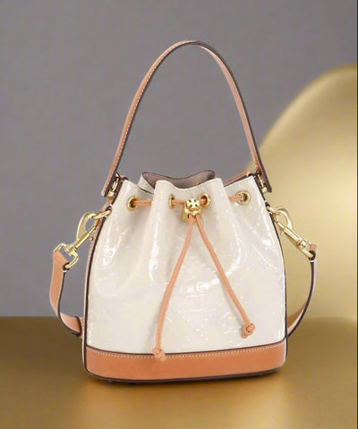 Tory Burch T Monogram Embossed Patent Leather Cream And Tan Bucket Bag