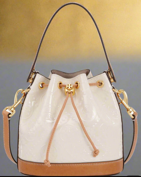 Tory Burch T Monogram Embossed Patent Leather Cream And Tan Bucket Bag